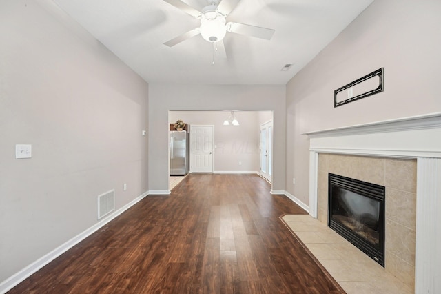 3947 Summerstone Dr, Columbus, OH 43230 - unfurnished living room featuring wood finished floors, a tiled fireplace, ceiling fan, and baseboards