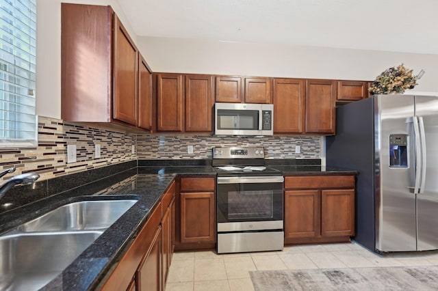 3947 Summerstone Dr, Columbus, OH 43230 - kitchen with appliances with stainless steel finishes, a sink, decorative backsplash, and light tile patterned floors