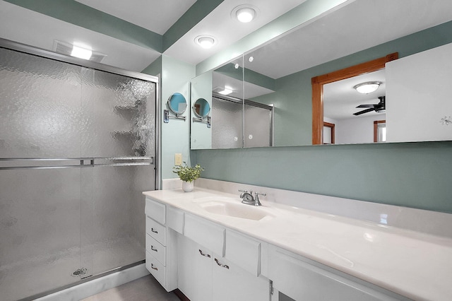 bathroom featuring vanity and a stall shower
