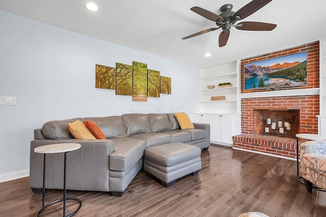living room with baseboards, a fireplace, recessed lighting, ceiling fan, and wood finished floors