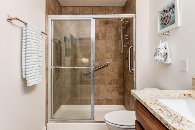 4889 Ashleigh Dr, Dublin, OH 43016 - bathroom with a shower stall, vanity, and toilet