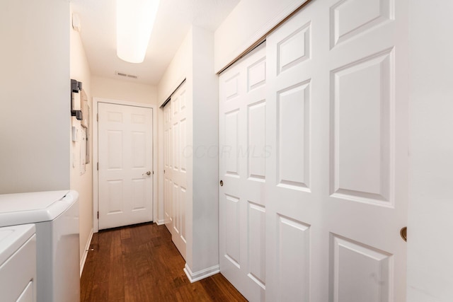 4889 Ashleigh Dr, Dublin, OH 43016 - washroom featuring laundry area, dark wood finished floors, visible vents, baseboards, and washing machine and dryer
