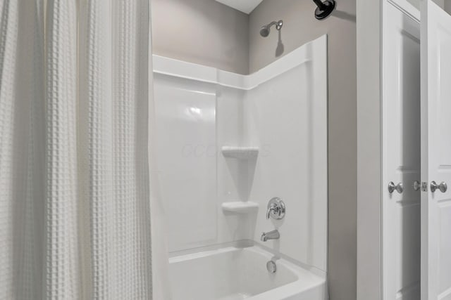 full bathroom with shower / bath combo with shower curtain