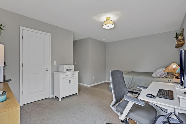 home office featuring light colored carpet and baseboards