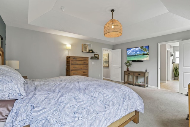 carpeted bedroom featuring visible vents and baseboards
