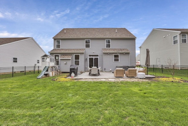 back of house featuring roof with shingles, outdoor lounge area, a patio area, a playground, and a lawn