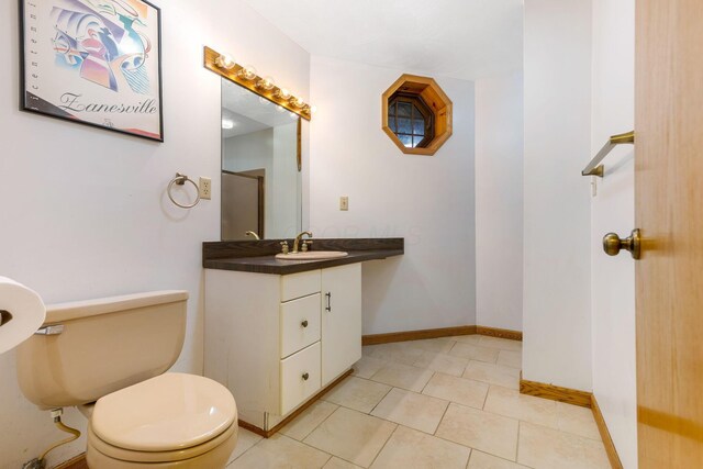 8778 Township Rd 36, Somerset, OH 43783 - bathroom with toilet, vanity, baseboards, and tile patterned flooring
