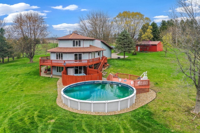 8778 Township Rd 36, Somerset, OH 43783 - pool featuring a yard, a deck, and an outbuilding