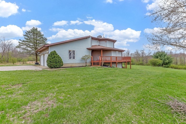 8778 Township Rd 36, Somerset, OH 43783 - rear view of property featuring a yard, a wooden deck, a garage, and driveway