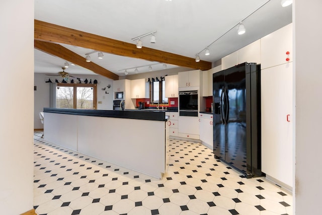 8778 Township Rd 36, Somerset, OH 43783 - kitchen with track lighting, white cabinets, black refrigerator with ice dispenser, stainless steel microwave, and dark countertops
