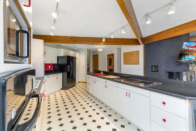 8778 Township Rd 36, Somerset, OH 43783 - kitchen featuring rail lighting, dark countertops, black appliances, light floors, and a sink