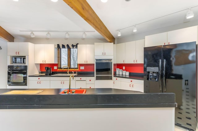 8778 Township Rd 36, Somerset, OH 43783 - kitchen featuring a sink, track lighting, black appliances, and dark countertops