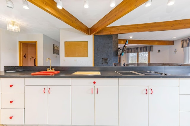 8778 Township Rd 36, Somerset, OH 43783 - kitchen with beamed ceiling, dark countertops, and black electric cooktop