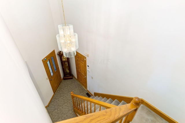 8778 Township Rd 36, Somerset, OH 43783 - hallway with baseboards, an inviting chandelier, and carpet