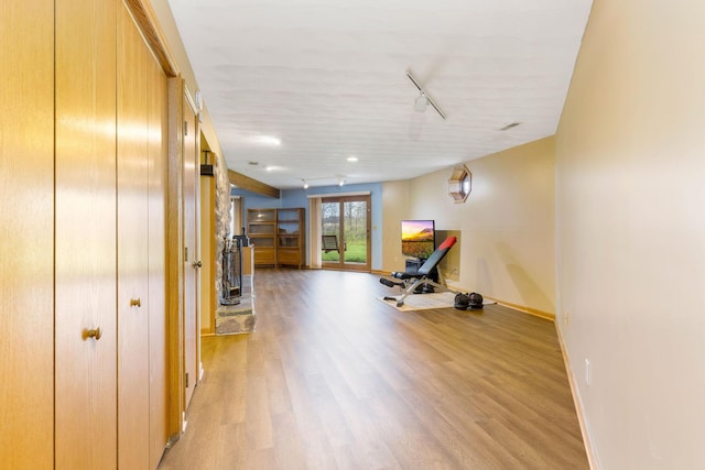 8778 Township Rd 36, Somerset, OH 43783 - exercise area with rail lighting, light wood-type flooring, and baseboards