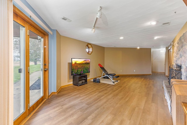 8778 Township Rd 36, Somerset, OH 43783 - exercise room featuring light wood finished floors, visible vents, baseboards, and track lighting
