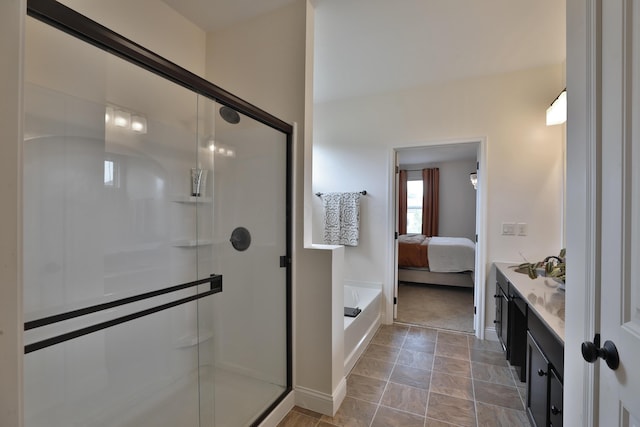 full bathroom featuring a shower stall, baseboards, a bathtub, and connected bathroom