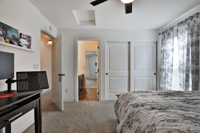 carpeted bedroom with a closet, attic access, baseboards, and multiple windows