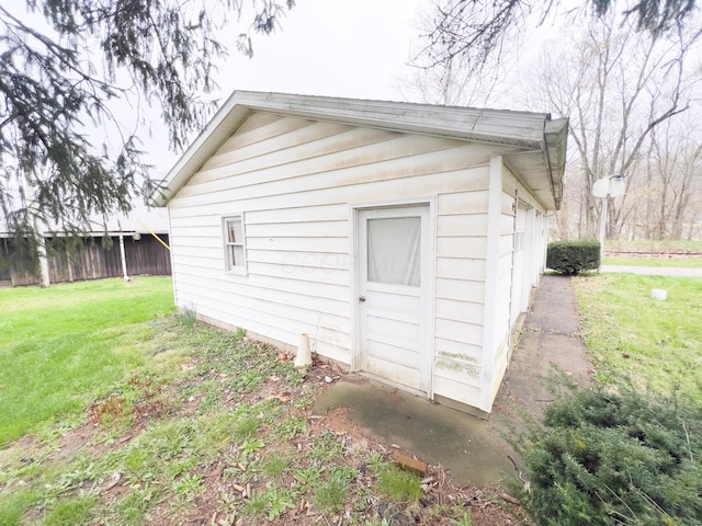 view of outbuilding with an outdoor structure and fence