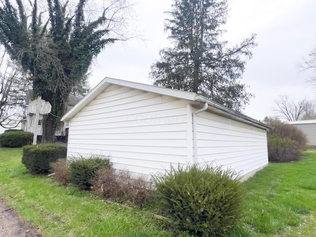 view of home's exterior with a lawn