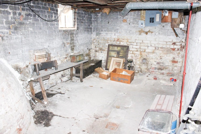unfinished basement featuring electric panel
