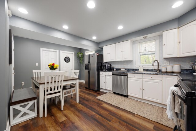 5514 Fairfield Rd, Orient, OH 43146 - kitchen with appliances with stainless steel finishes, a sink, dark wood-type flooring, tasteful backsplash, and recessed lighting