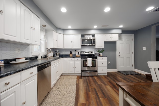5514 Fairfield Rd, Orient, OH 43146 - kitchen featuring stainless steel appliances, a sink, tasteful backsplash, recessed lighting, and dark wood-style floors