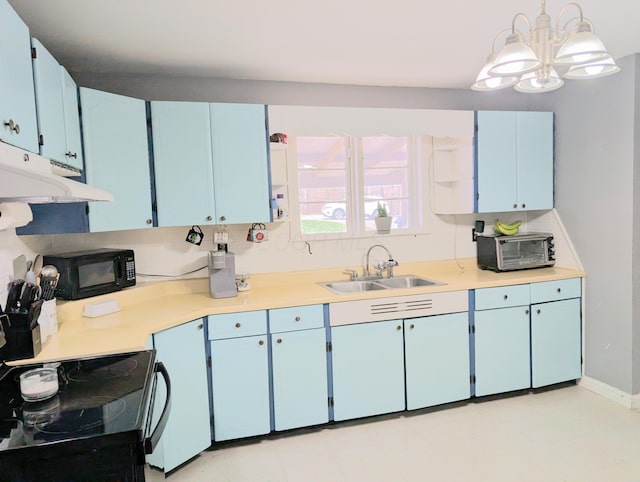 kitchen featuring a sink, black appliances, and blue cabinetry