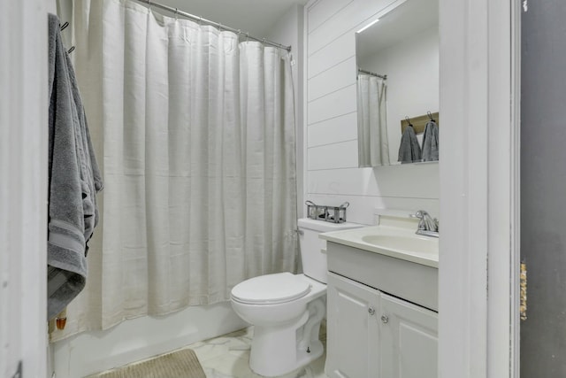 full bath featuring toilet, shower / bathtub combination with curtain, marble finish floor, and vanity