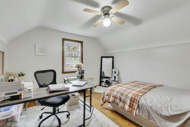bedroom with light wood-style flooring, a ceiling fan, and lofted ceiling