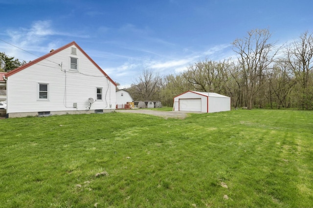 view of yard with an outbuilding and a garage