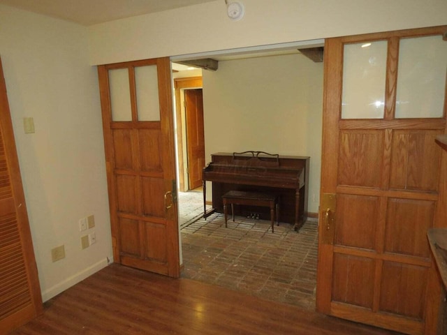 11 Plumb St, Lockbourne, OH 43137 - hallway with dark wood-type flooring and baseboards