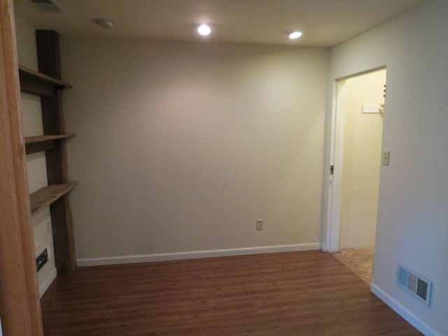 11 Plumb St, Lockbourne, OH 43137 - interior space featuring visible vents, baseboards, recessed lighting, wood finished floors, and a glass covered fireplace