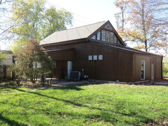 11 Plumb St, Lockbourne, OH 43137 - view of side of property with central air condition unit and a lawn
