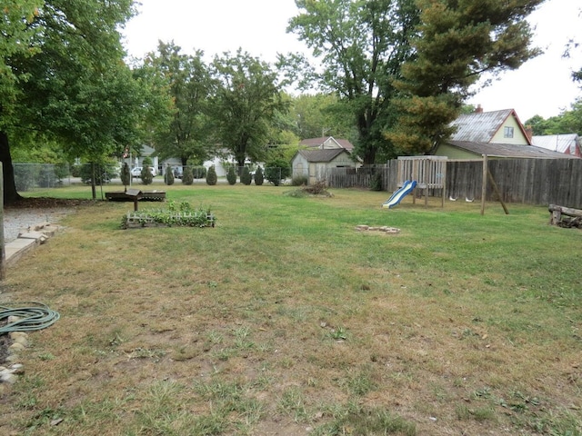 11 Plumb St, Lockbourne, OH 43137 - view of yard with a fenced backyard and a playground