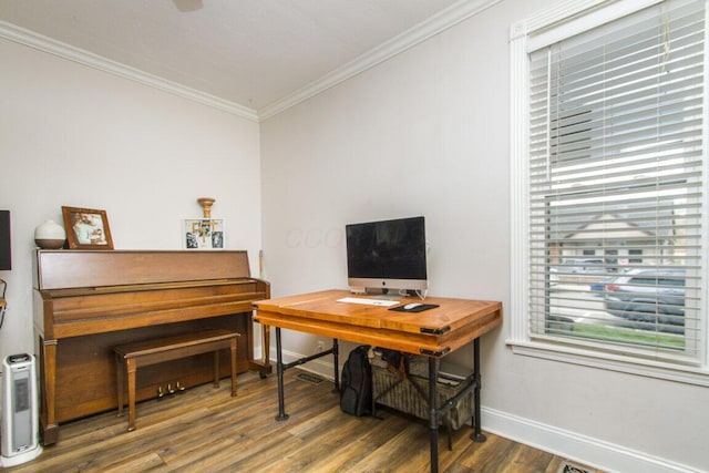 office area featuring ornamental molding, baseboards, a wealth of natural light, and wood finished floors