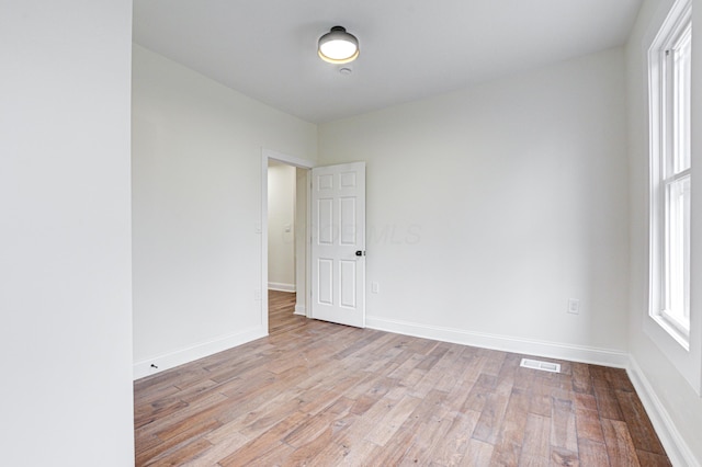344 E Whittier St, Columbus, OH 43206 - spare room featuring light wood finished floors, visible vents, and baseboards