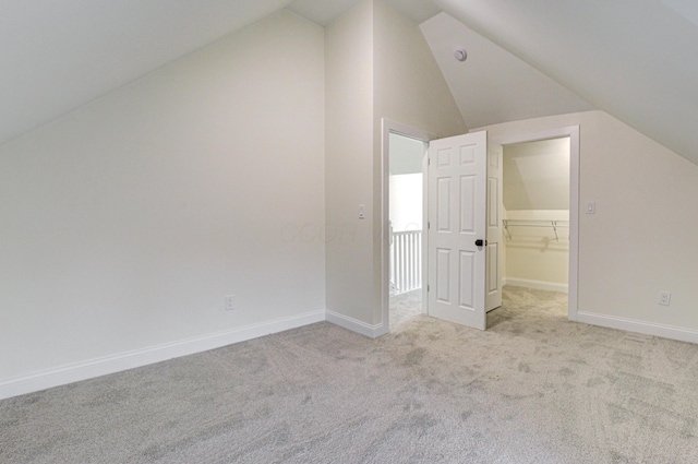 344 E Whittier St, Columbus, OH 43206 - additional living space featuring baseboards, light colored carpet, and vaulted ceiling