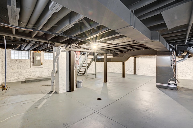 344 E Whittier St, Columbus, OH 43206 - below grade area featuring heating unit, electric panel, and stairs