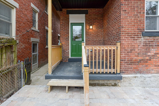 344 E Whittier St, Columbus, OH 43206 - doorway to property with brick siding and fence