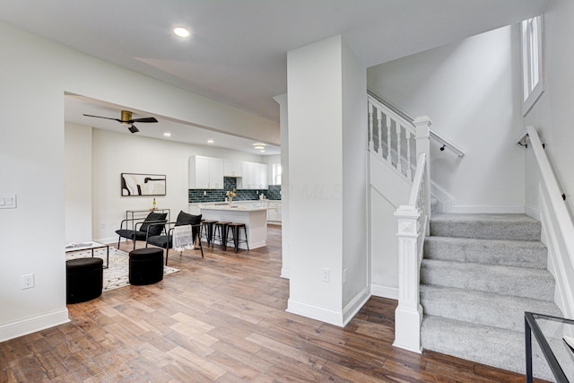 344 E Whittier St, Columbus, OH 43206 - staircase with baseboards, recessed lighting, wood finished floors, and a ceiling fan