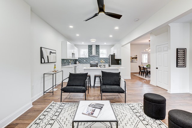 344 E Whittier St, Columbus, OH 43206 - living area featuring ceiling fan, light wood-type flooring, recessed lighting, and baseboards