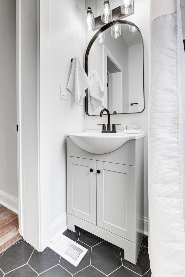 344 E Whittier St, Columbus, OH 43206 - bathroom featuring tile patterned floors, vanity, and baseboards