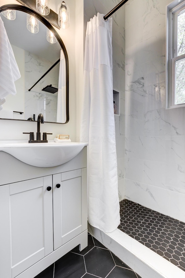 344 E Whittier St, Columbus, OH 43206 - bathroom with tile patterned floors, a shower with curtain, and vanity