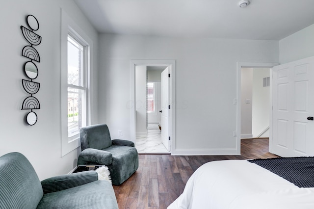 344 E Whittier St, Columbus, OH 43206 - bedroom featuring dark wood-style floors, visible vents, multiple windows, and baseboards