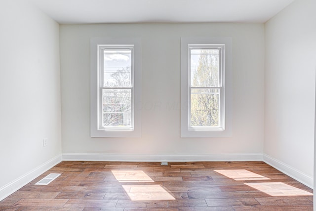 344 E Whittier St, Columbus, OH 43206 - empty room featuring visible vents, wood finished floors, and baseboards