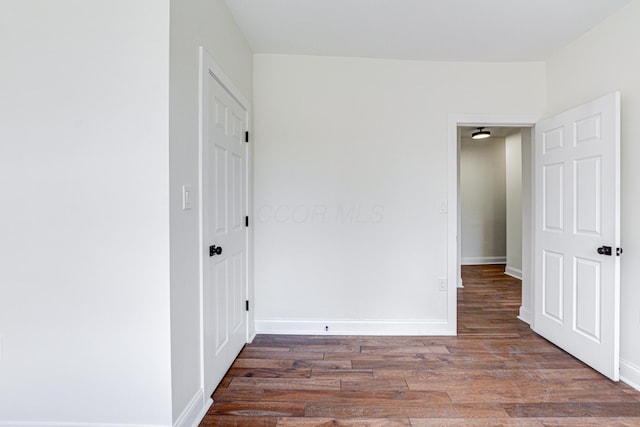 344 E Whittier St, Columbus, OH 43206 - unfurnished bedroom featuring baseboards and wood finished floors