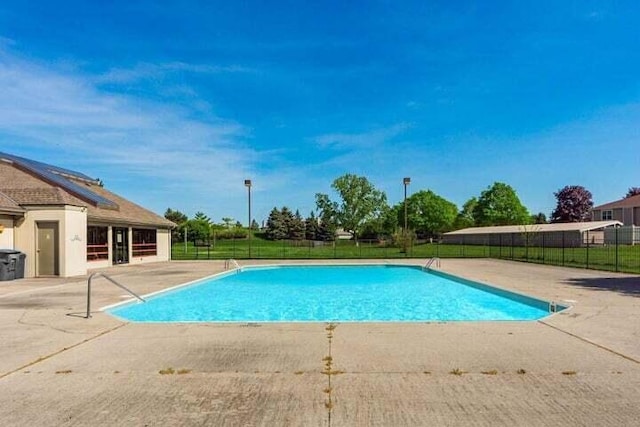 5631 Barney Ln Unit 43D, Columbus, OH 43235 - view of swimming pool with a patio area, a fenced in pool, and fence