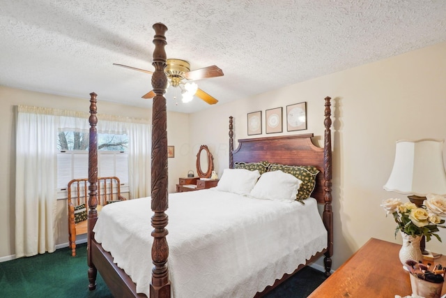 carpeted bedroom featuring a textured ceiling and a ceiling fan