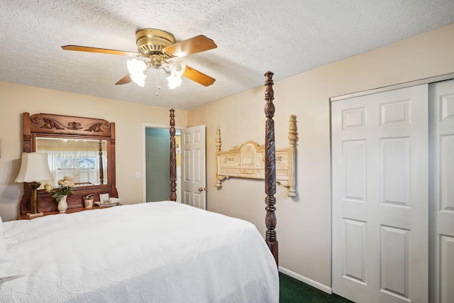 bedroom featuring baseboards, a ceiling fan, dark colored carpet, and a textured ceiling